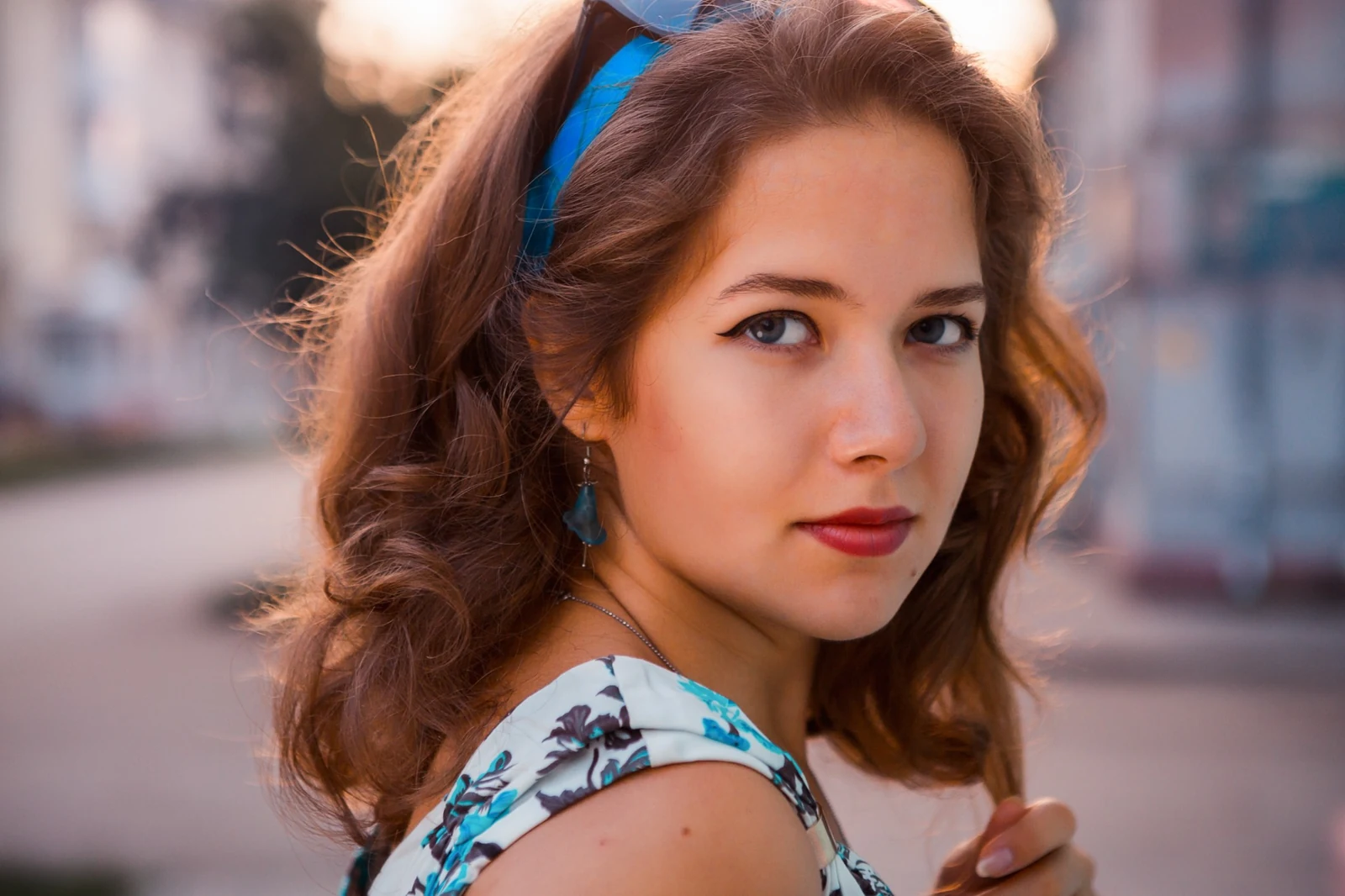 A young woman in a blue dress
